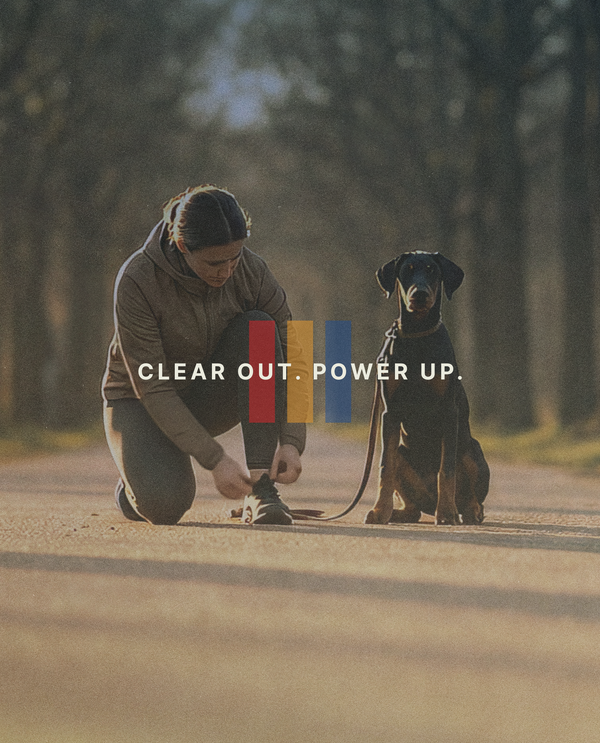 A girl and a dog about to go for a run outside.