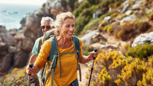 A middle-aged couple hiking on a mountain.